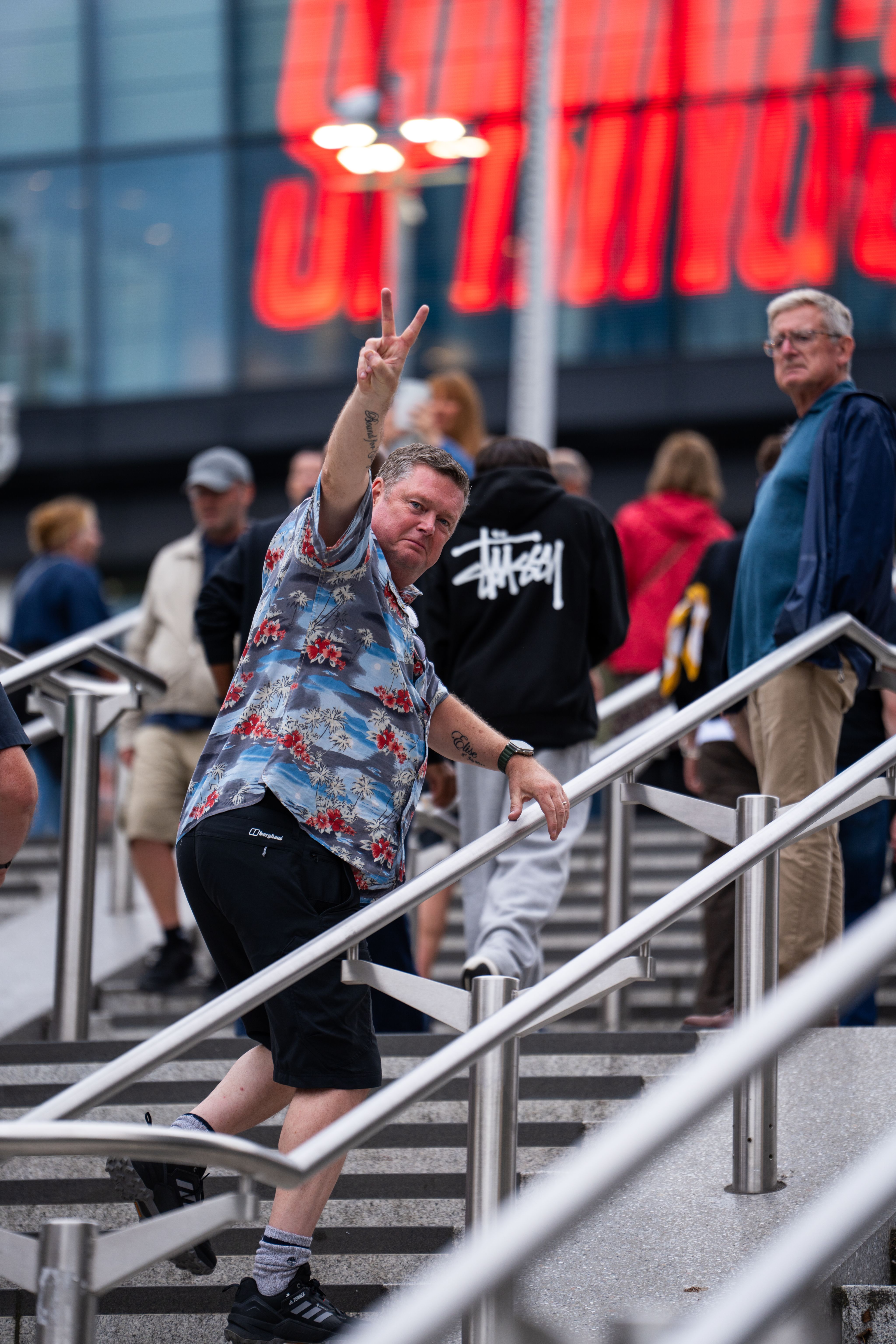 A Bruce fan flashes the peace sign as he heads in to Wembley