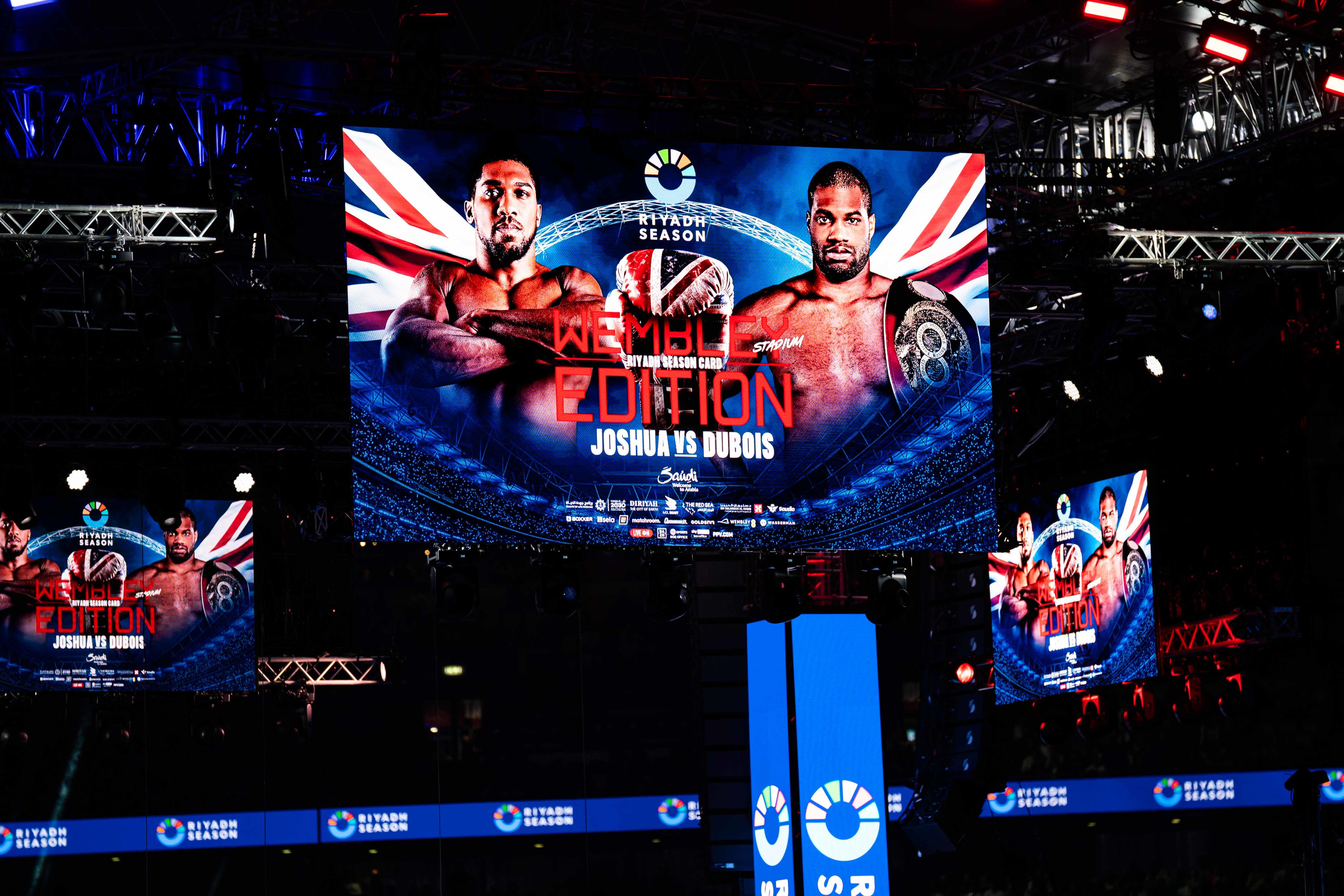 A photo of the screens above the ring which read 'Wembley Edition' and features Joshua Dubois