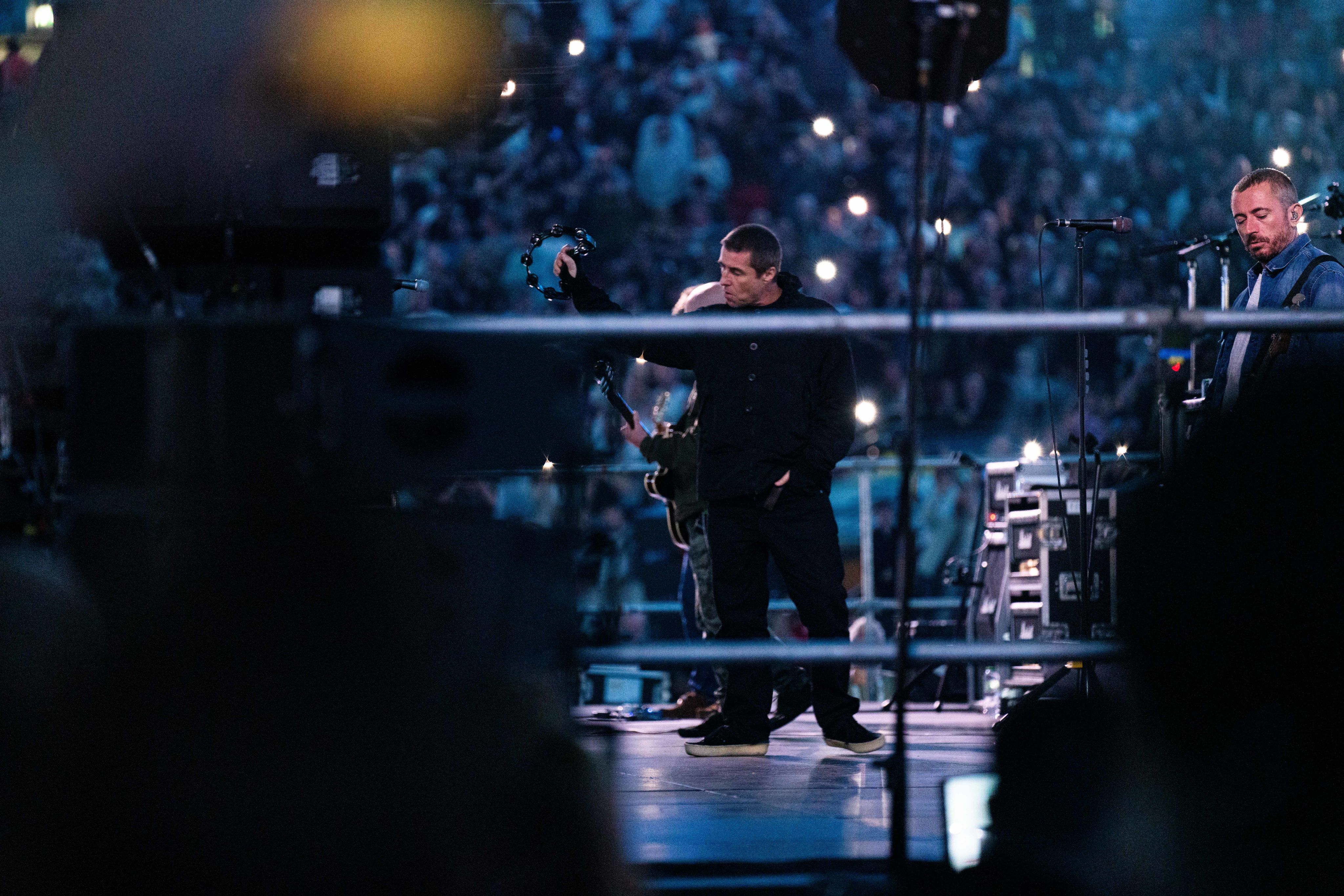 Liam Gallagher performs on stage in the build up to Joshua Dubois