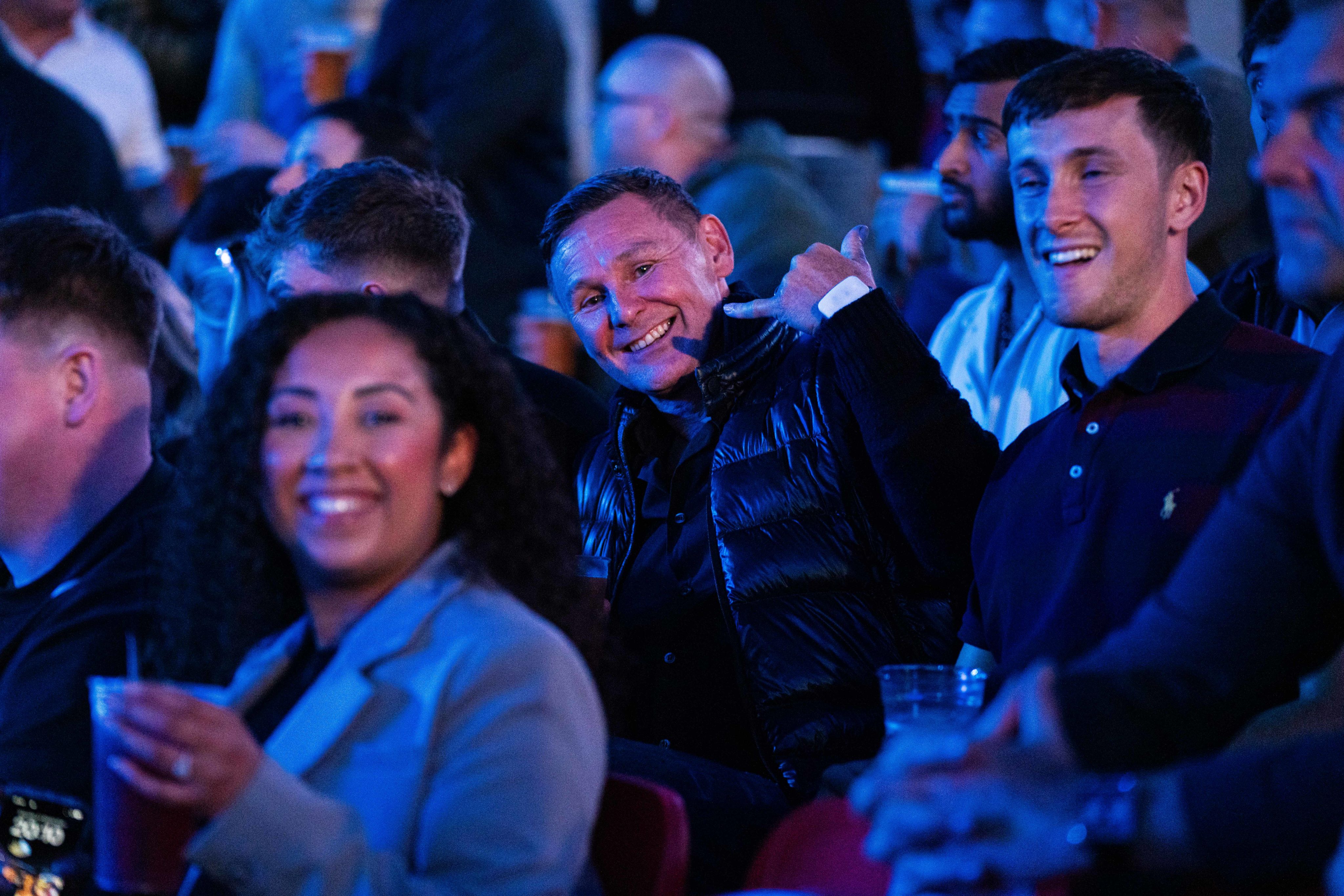 Boxing fans pose inside the stadium during the build up to Joshua Dubois