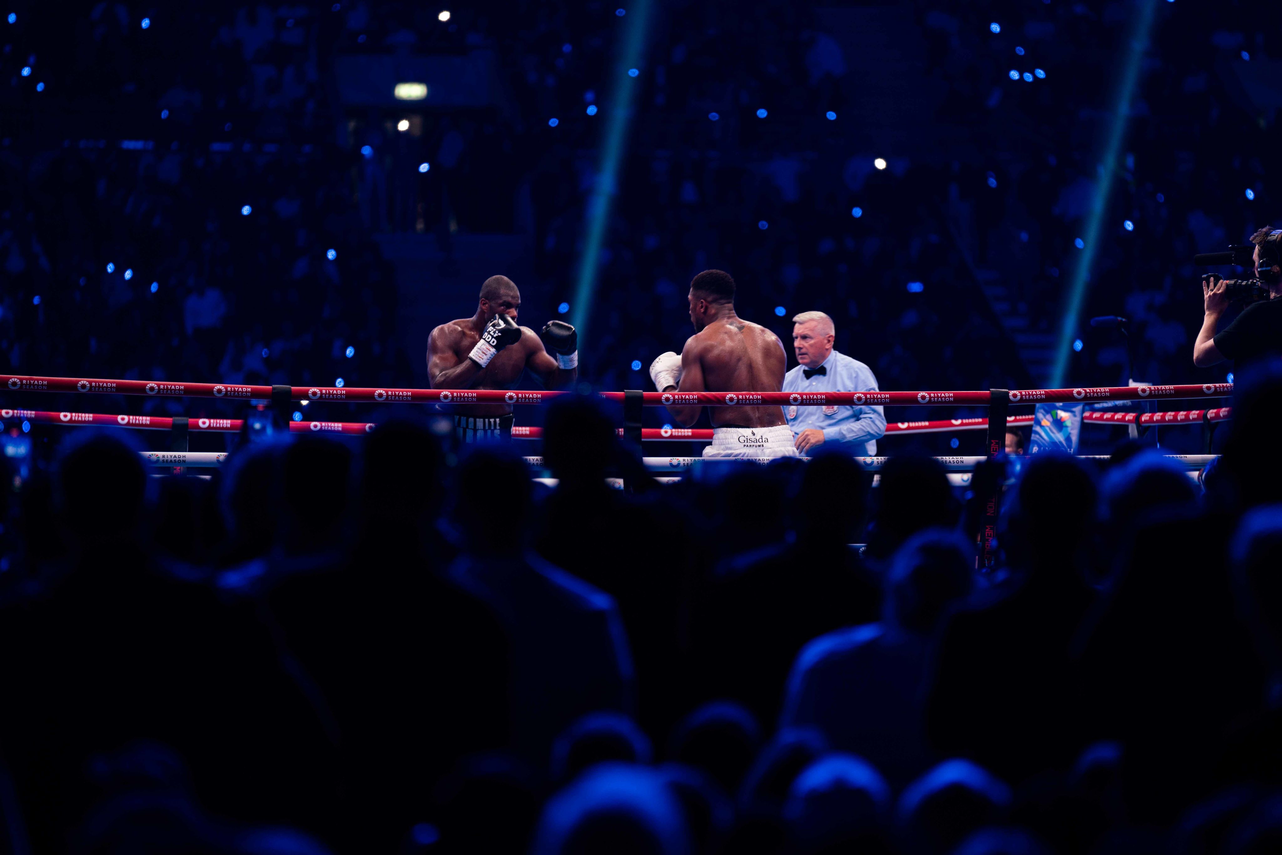 A photo taken from the crowd as both boxers face off during Joshua Dubois