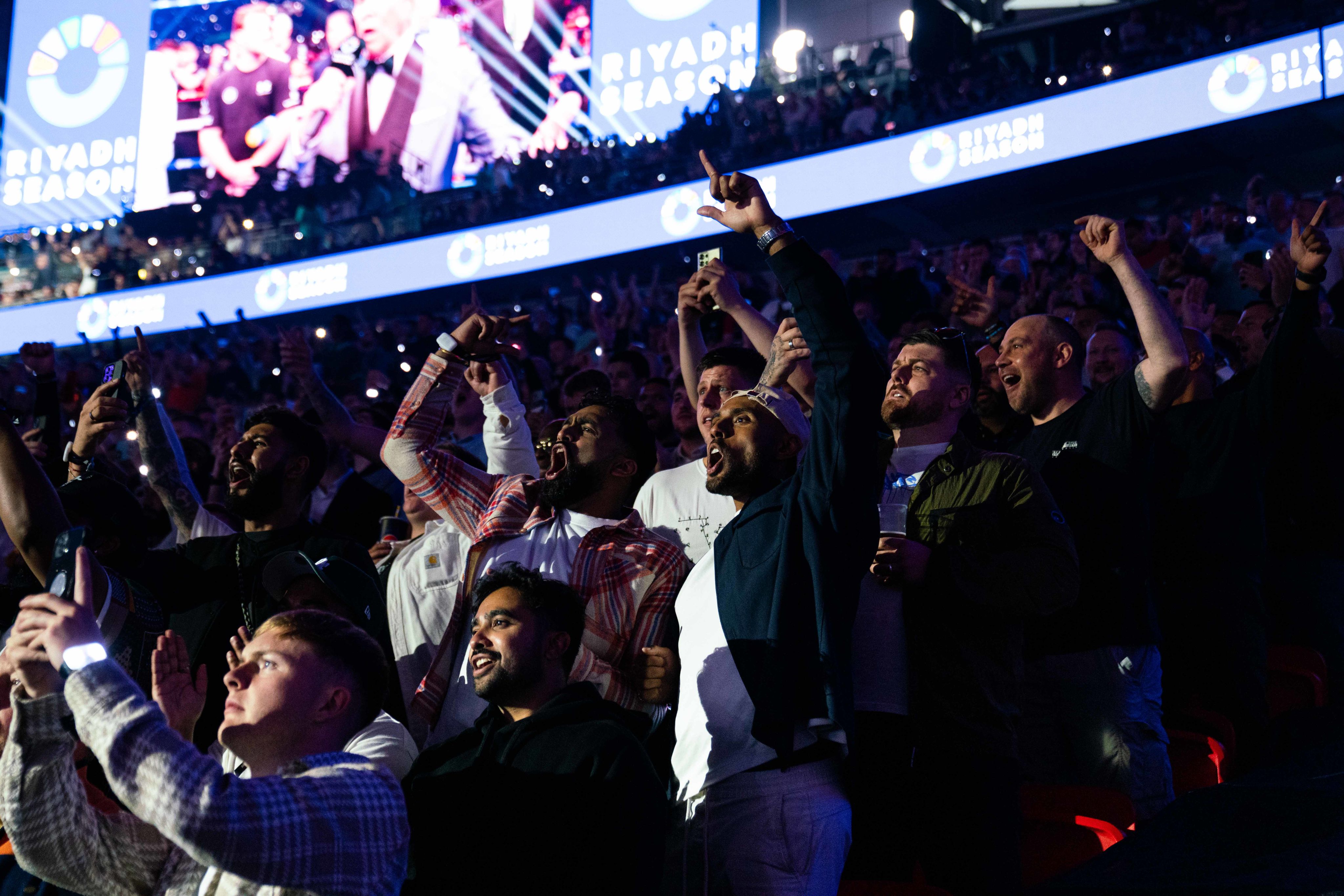 A photo of fans celebrating during the knock down